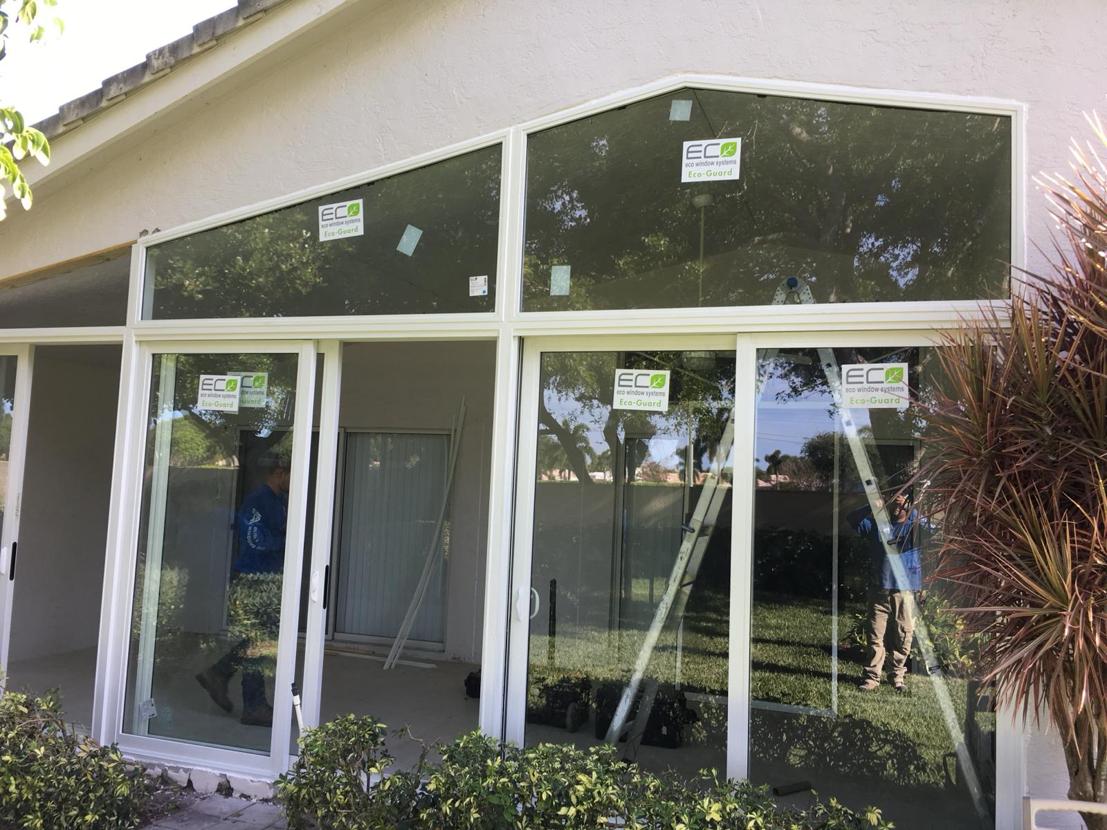 Modern black impact entry doors with frosted glass panels