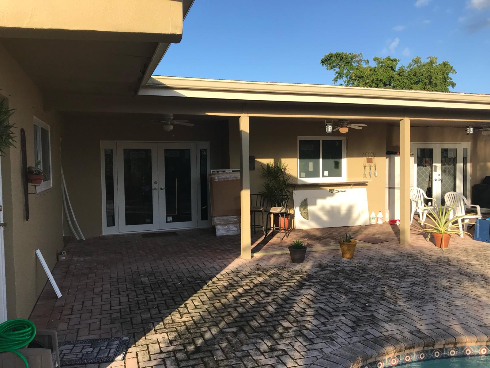 Impact-rated French doors and windows installed on a South Florida patio
