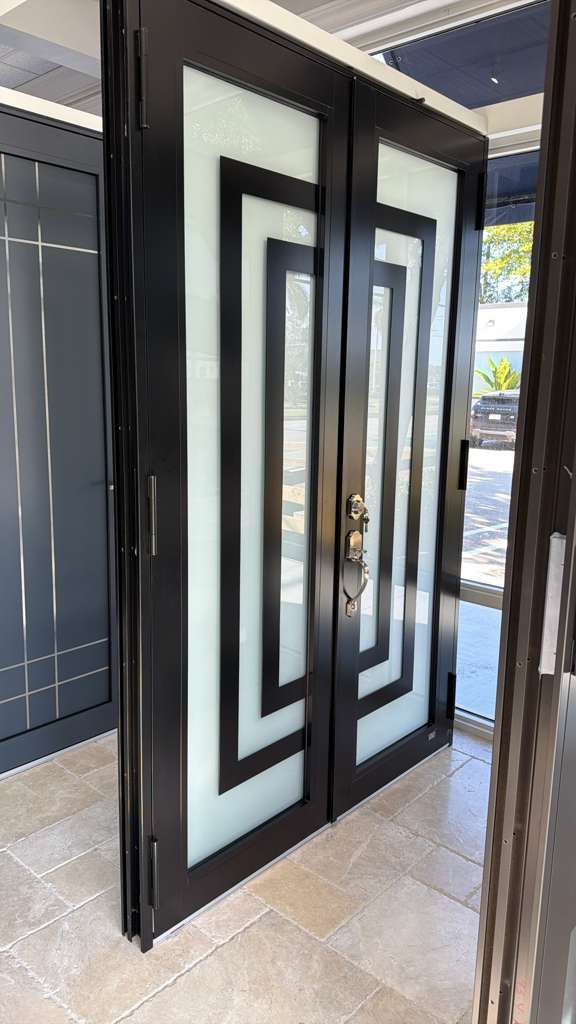 Full impact window and door package on a light blue two-story home