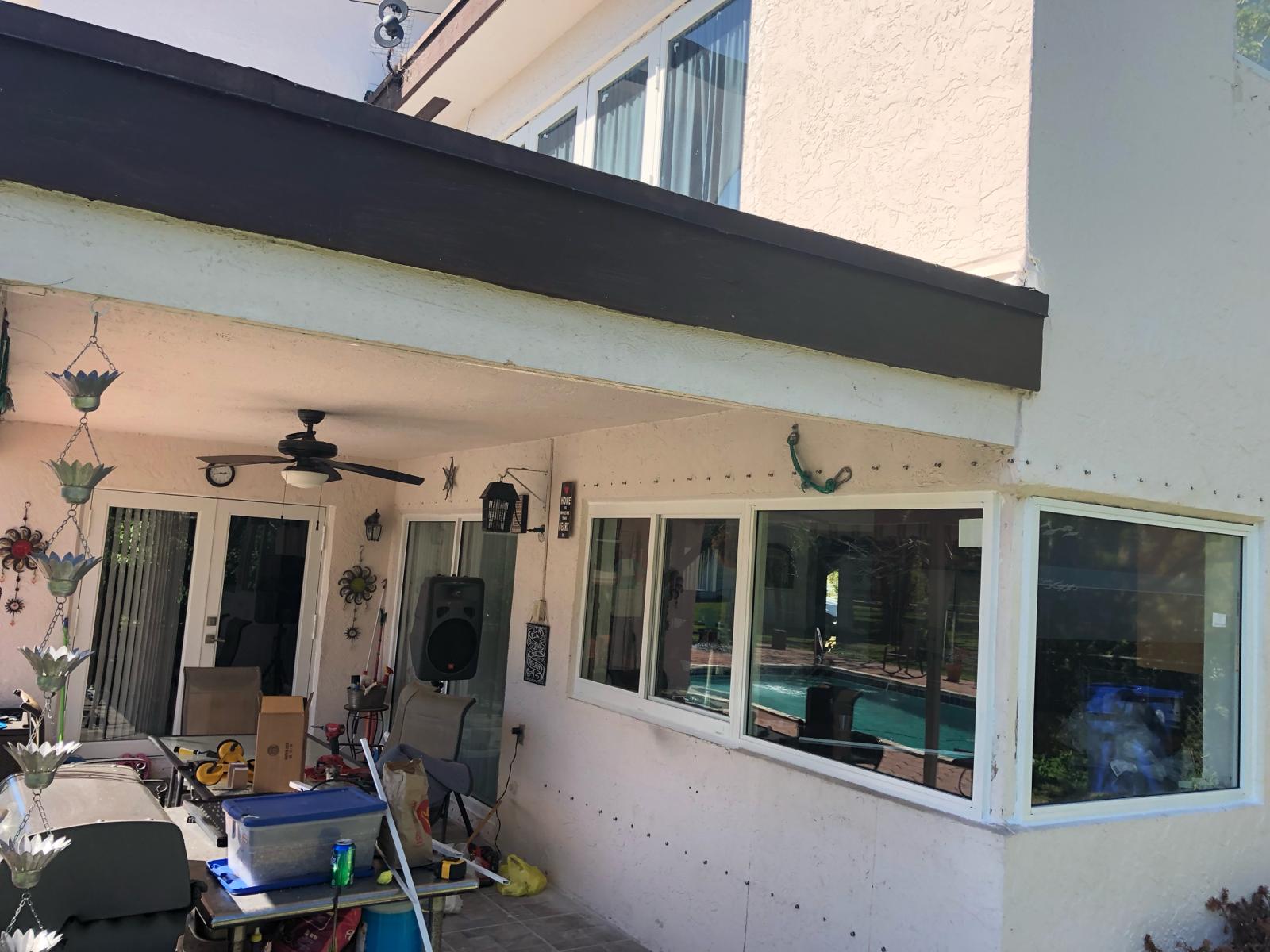 Impact window and sliding glass door replacement on a poolside patio