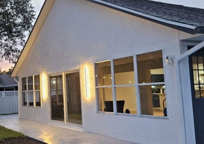 New impact windows on a Florida home at dusk